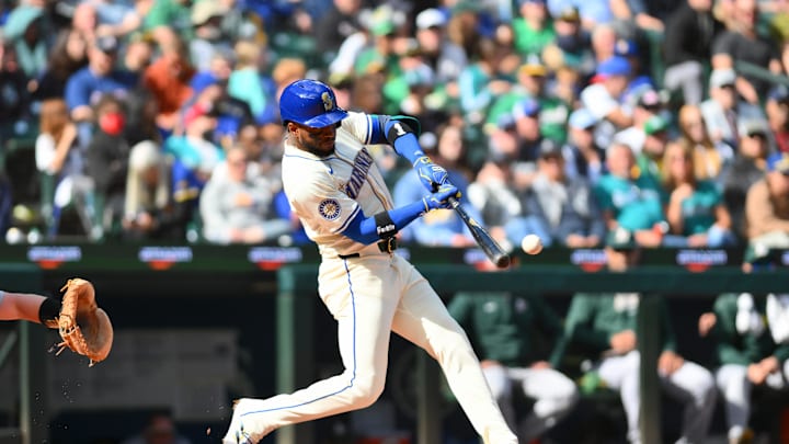 Seattle Mariners right fielder Victor Robles (10) hits an RBI double against the Oakland Athletics during the fifth inning at T-Mobile Park in 2024.