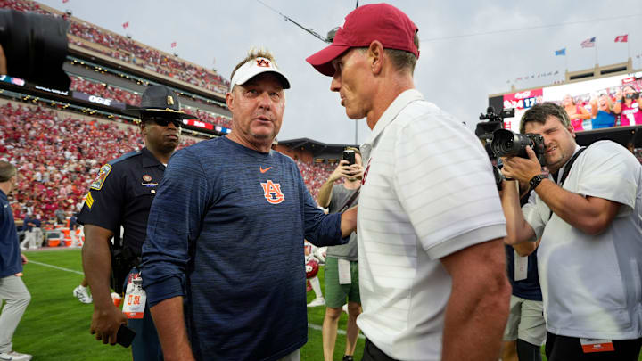 Auburn coach Hugh Freeze and Oklahoma coach Brent Venables talk after a college football game between the University of Oklahoma Sooners (OU) and the Auburn Tigers at Gaylord Family Ð Oklahoma Memorial Stadium in Norman, Okla., Saturday,Sept. 20, 2025. Oklahoma won 24-17.