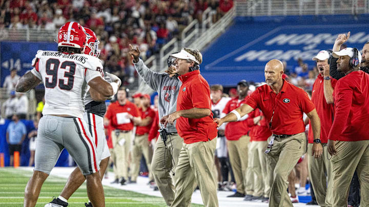 Sep 14, 2024; Lexington, Kentucky, USA; Georgia Bulldogs head coach Kirby Smart is pulled off the field during the third quarter of the game against the Kentucky Wildcats at Kroger Field. Mandatory Credit: Tanner Pearson-Imagn Images