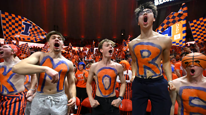 Feb 27, 2026; Champaign, Illinois, USA; Illinois Fighting Illini fans cheer during the first half against the Michigan Wolverines at State Farm Center. Mandatory Credit: Ron Johnson-Imagn Images Feb 27, 2026; Champaign, Illinois, USA; Illinois Fighting Illini fans cheer during the first half against the Michigan Wolverines at State Farm Center. Mandatory Credit: Ron Johnson-Imagn Images