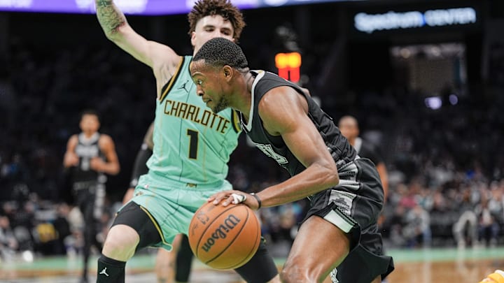 Feb 7, 2025; Charlotte, North Carolina, USA; San Antonio Spurs guard De'Aaron Fox (4) drives to the basket against Charlotte Hornets guard LaMelo Ball (1) during the second half at Spectrum Center. Mandatory Credit: Jim Dedmon-Imagn Images Feb 7, 2025; Charlotte, North Carolina, USA; San Antonio Spurs guard De'Aaron Fox (4) drives to the basket against Charlotte Hornets guard LaMelo Ball (1) during the second half at Spectrum Center. Mandatory Credit: Jim Dedmon-Imagn Images