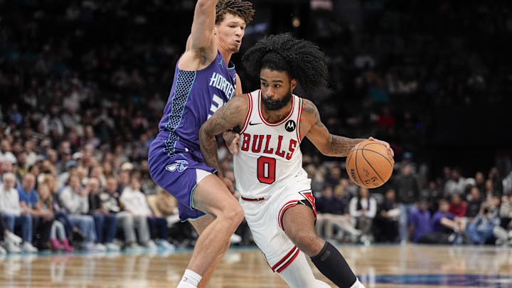 Chicago Bulls guard Coby White (0) drives to the basket against Charlotte Hornets forward Tidjane Salaun