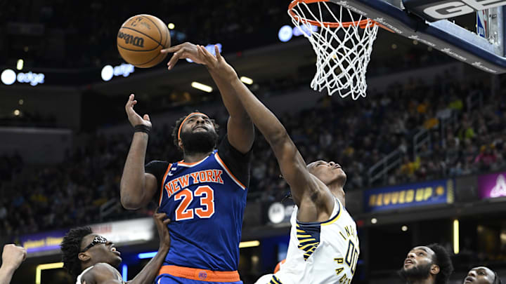 Apr 5, 2023; Indianapolis, Indiana, USA; New York Knicks center Mitchell Robinson (23) blocks a shot by Indiana Pacers guard Bennedict Mathurin (00) during the second half at Gainbridge Fieldhouse. Knicks won 138-129. Mandatory Credit: Marc Lebryk-Imagn Images
