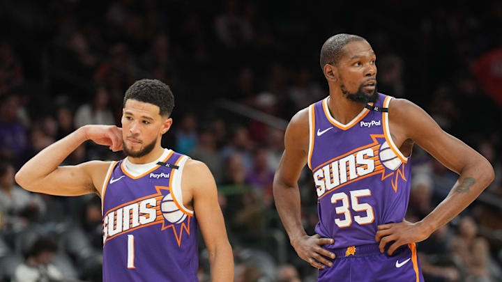 Nov 27, 2024; Phoenix, Arizona, USA; Phoenix Suns guard Devin Booker (1) and Phoenix Suns forward Kevin Durant (35) look on against the Brooklyn Nets during the second half at Footprint Center. Mandatory Credit: Joe Camporeale-Imagn Images Nov 27, 2024; Phoenix, Arizona, USA; Phoenix Suns guard Devin Booker (1) and Phoenix Suns forward Kevin Durant (35) look on against the Brooklyn Nets during the second half at Footprint Center. Mandatory Credit: Joe Camporeale-Imagn Images