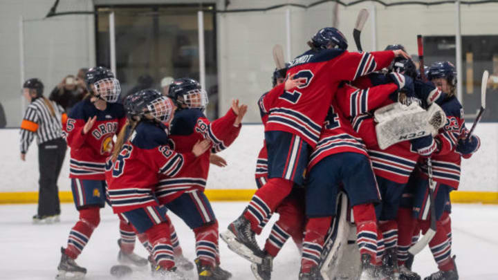 Orono girls hockey celebrates winning a section tournament in 2023.