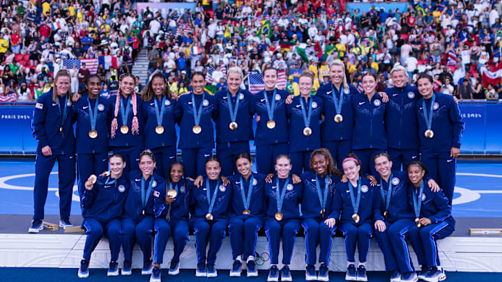 USWNT with their gold medals after the 2024 Olympic final v Brazil 