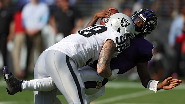 Las Vegas Raiders #98, Defensive End, Maxx Crosby sacks Baltimore Ravens # 8, Quarterback, Lamar Jackson in Raiders 26-23 Week 2 Victory in 2024. 