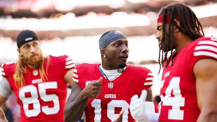 San Francisco 49ers tight end George Kittle (L), wide receiver Deebo Samuel (C) and linebacker Fred Warner (R)