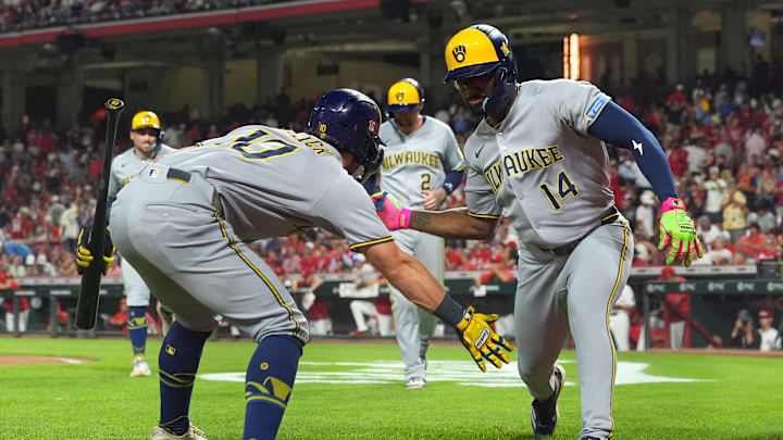 Milwaukee Brewers players Sal Frelick and Andruw Monasterio celebrate against the Cincinatti Reds.