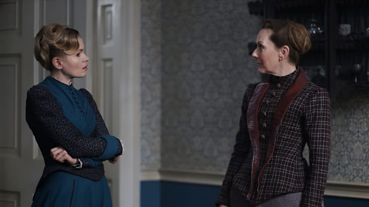 MASTERPIECE
Miss Scarlet, Season 6 
 
Streaming Dec. 7, 2025 on the PBS app
Premiering Jan. 11, 2026 on PBS

Episode One: Secrets and Lies
In a case centered around the fledgling world of psychiatry, a violent psychiatric patient is on the loose, leaving behind a murder, a mystery and an unidentified body. Blake hires Eliza to help him solve the case.

Shown L-R: Eliza Scarlet (Kate Phillips), Ivy Potts (Cathy Belton)

Photographer: Maja Medic
 
For editorial use only.
 
Courtesy of Miss Scarlet