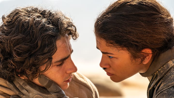(L-r) TIMOTHÉE CHALAMET as Paul Atreides and ZENDAYA as Chani in Warner Bros. Pictures and Legendary Pictures’ action adventure “DUNE: PART TWO,” a Warner Bros. Pictures release. Photo Credit: Niko Tavernise © 2023 Warner Bros. Entertainment Inc. All Rights Reserved.