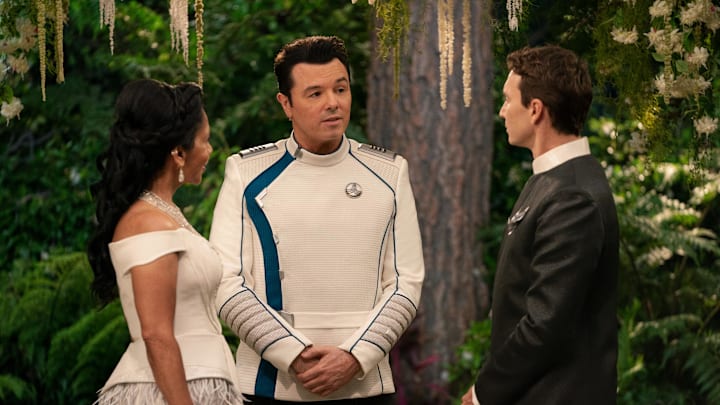 The Orville: New Horizons -- “Future Unknown” - Episode 310 -- A celebration is underway aboard the ship on the season three finale of “The Orville: New Horizons”. Dr. Claire Finn (Penny Johnson Jerald), Capt. Ed Mercer (Seth MacFarlane), and Issac (Mark Jackson), shown. (Photo by: Gilles Mingasson/Hulu)