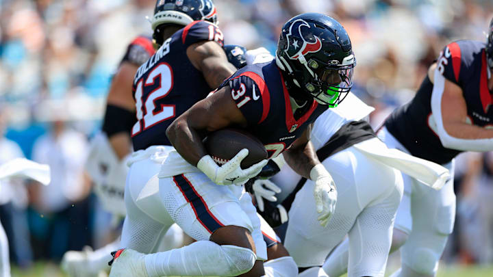 Houston Texans running back Dameon Pierce (31) rushes for yards during the first quarter of an NFL