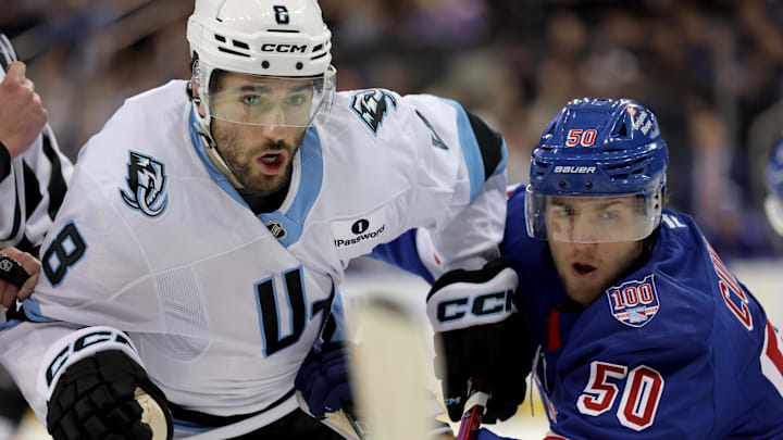 Jan 5, 2026; New York, New York, USA; Utah Mammoth center Nick Schmaltz (8) skates against New York Rangers left wing Will Cuylle (50) during the first period at Madison Square Garden. Mandatory Credit: Brad Penner-Imagn Images