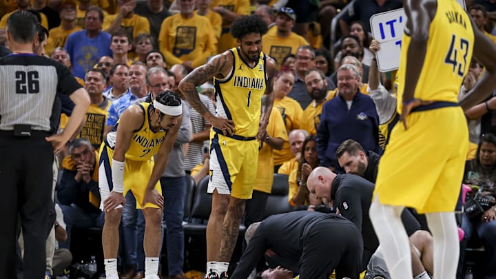 May 27, 2024; Indianapolis, Indiana, USA; Medical personnel tend to injured Indiana Pacers guard T.J. McConnell (9) during the fourth quarter during game four of the eastern conference finals for the 2024 NBA playoffs at Gainbridge Fieldhouse. Mandatory Credit: Trevor Ruszkowski-USA TODAY Sports