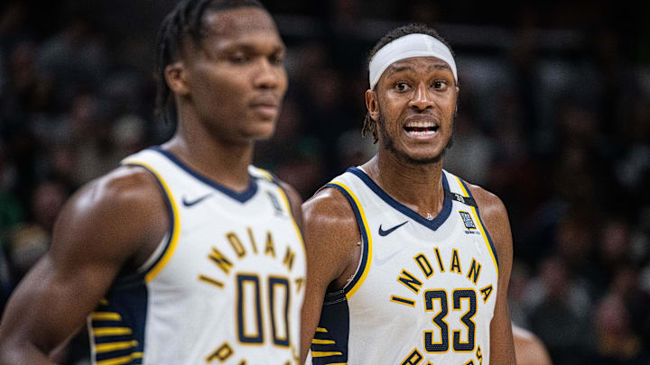Jan 8, 2024; Indianapolis, Indiana, USA; Indiana Pacers center Myles Turner (33) talks to guard Bennedict Mathurin (00) after a timeout  in the second half against the Boston Celtics at Gainbridge Fieldhouse. Mandatory Credit: Trevor Ruszkowski-Imagn Images