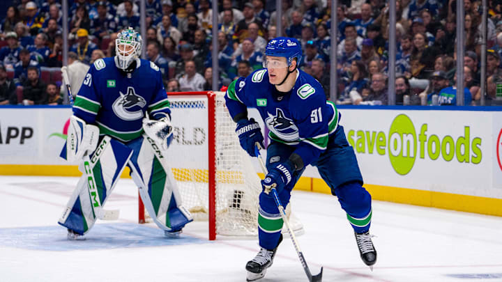 May 16, 2024; Vancouver, British Columbia, CAN; Vancouver Canucks goalie Arturs Silvos (31) watches as defenseman Nikita Zadorov (91) handles the puck against the Edmonton Oilers during the second period in game five of the second round of the 2024 Stanley Cup Playoffs at Rogers Arena. Mandatory Credit: Bob Frid-USA TODAY Sports