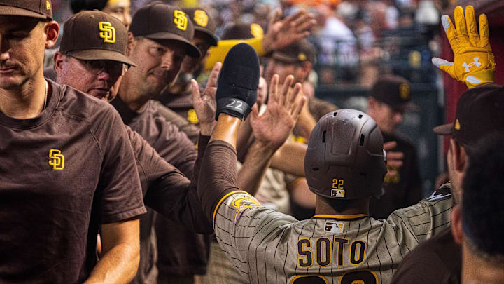 San Diego Padres outfielder Juan Soto (22) celebrates with teammates and coaches