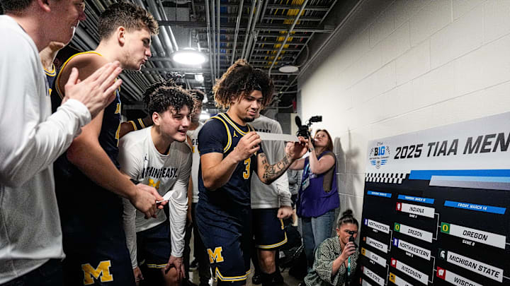 Michigan guard Tre Donaldson (3) and teammates celebrate advancing to the Big Ten Tournament final after defeating Maryland 81-80 at Gainbridge Fieldhouse in Indianapolis, Ind. on Saturday, March 15, 2025.