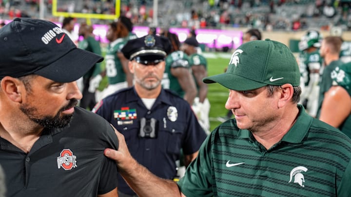 Michigan State Spartans head coach Jonathan Smith shakes hands with Ohio State Buckeyes head coach Ryan Day after the NCAA football game against Ohio State University at Spartan Stadium in East Lansing, Saturday, Sept. 28, 2024.