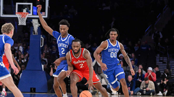 Dec 21, 2024; New York, New York, USA; Ohio State Buckeyes guard Bruce Thornton (2) brings the ball up court while being defended by Kentucky Wildcats guard Jaxson Robinson (2) during the second half at Madison Square Garden. Mandatory Credit: John Jones-Imagn Images