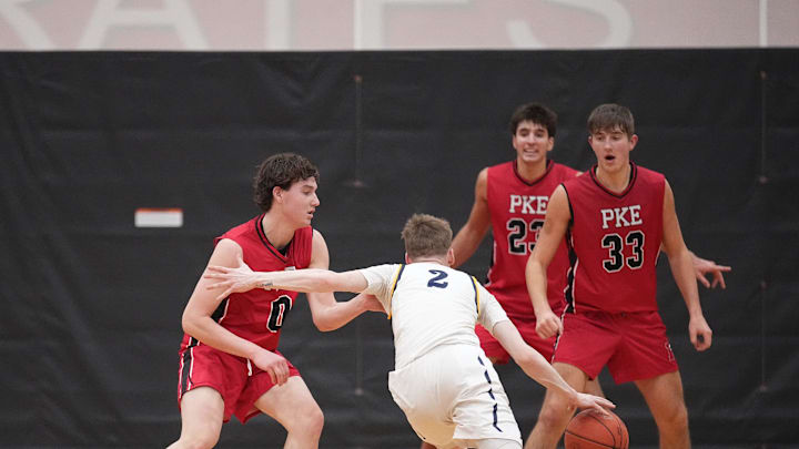 Whitnall's Myles Herro (2) works to get around Pewaukee's Royce Bur (0) during the game at Pewaukee on Friday, Jan. 31, 2025. Pewaukee won the game 76-74.