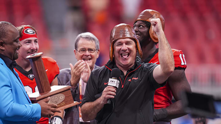 Aug 31, 2024; Atlanta, Georgia, USA; Georgia Bulldogs head coach Kirby Smart wears the old leather helmet after defeating the Clemson Tigers at Mercedes-Benz Stadium. Mandatory Credit: Dale Zanine-Imagn Images Aug 31, 2024; Atlanta, Georgia, USA; Georgia Bulldogs head coach Kirby Smart wears the old leather helmet after defeating the Clemson Tigers at Mercedes-Benz Stadium. Mandatory Credit: Dale Zanine-Imagn Images