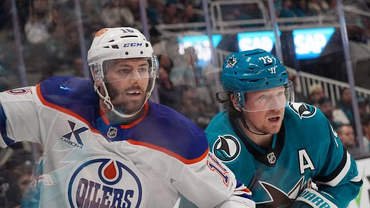 Apr 8, 2026; San Jose, California, USA;  Edmonton Oilers center Jason Dickinson (16) and San Jose Sharks center Tyler Toffoli (73) watch the puck in the second period at SAP Center at San Jose. Mandatory Credit: David Gonzales-Imagn Images