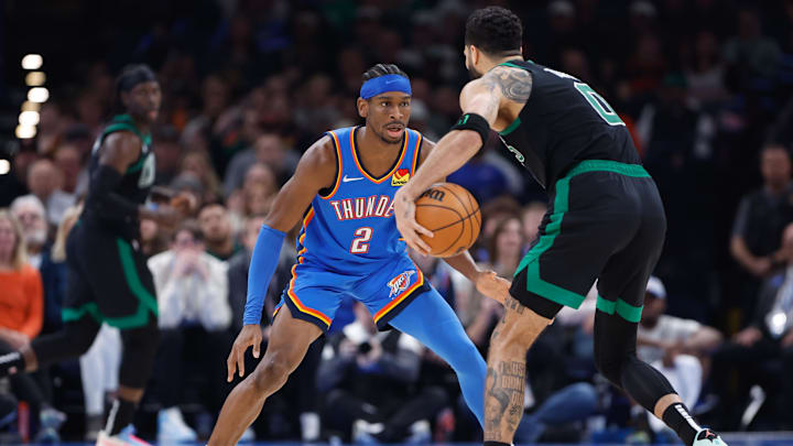 Jan 2, 2024; Oklahoma City, Oklahoma, USA; Oklahoma City Thunder guard Shai Gilgeous-Alexander (2) defends Boston Celtics forward Jayson Tatum (0) during the second quarter at Paycom Center. Mandatory Credit: Alonzo Adams-Imagn Images