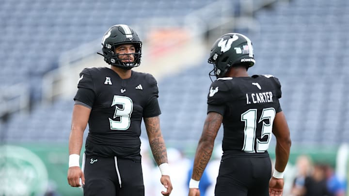 The Bulls blew out Tulsa Saturday and everyone got in on the 63-30 win., Backup quarterback Izzy Carter (13) threw two touchdowns as USF became  bowl eligible. 