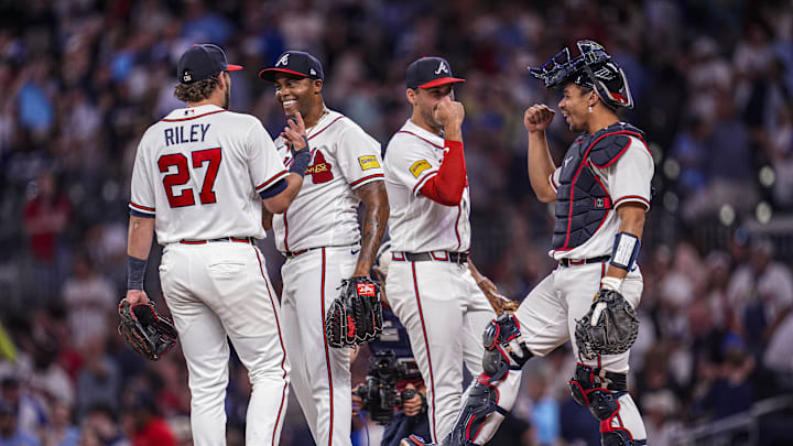 May 13, 2026; Cumberland, Georgia, USA; Atlanta Braves third baseman Austin Riley (27) pitcher Raisel Iglesias (26) first baseman Matt Olson (28) and catcher Drake Baldwin (30) react after defeating the Chicago Cubs at Truist Park. Mandatory Credit: Dale Zanine-Imagn Images