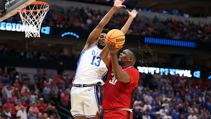 Mar 31, 2024; Dallas, TX, USA; North Carolina State Wolfpack forward DJ Burns Jr. (30) shoots over Duke basketball forward Sean Stewart