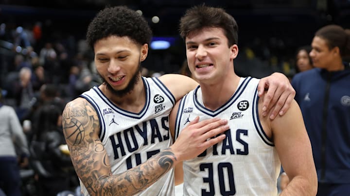 Dec 2, 2024; Washington, District of Columbia, USA; Georgetown Hoyas guard Kayvaun Mulready (45) and Georgetown Hoyas guard Michael Van Raaphorst (30) celebrate after a game against the UMBC Retrievers at Capital One Arena. Mandatory Credit: Daniel Kucin Jr.-Imagn Images