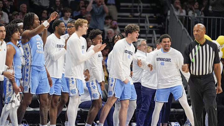 Mar 14, 2025; Charlotte, NC, USA; North Carolina Tar Heels bench erupts after a play against the Duke Blue Devils during the second half at Spectrum Center. Mandatory Credit: Jim Dedmon-Imagn Images