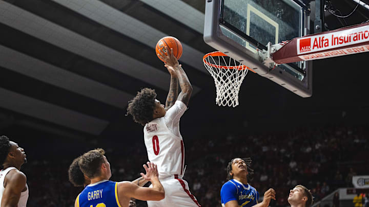 Dec 29, 2024; Tuscaloosa, Alabama, USA; Alabama Crimson Tide guard Labaron Philon (0) attempts a shot against the South Dakota State Jackrabbits during the first half at Coleman Coliseum. Mandatory Credit: Will McLelland-Imagn Images