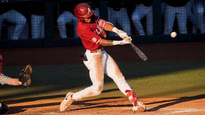 Feb 25, 2025; Tuscaloosa, AL, USA; Alabama hitter Justin Lebron hits a three-run homer against Jacksonville State at Sewell-Thomas Stadium.