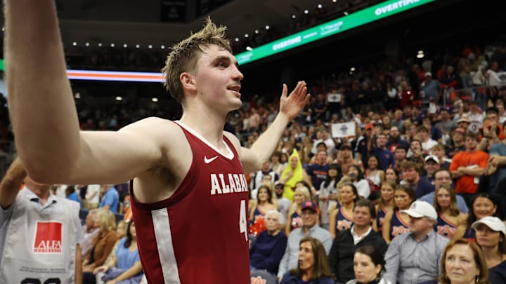 Mar 8, 2025; Auburn, Alabama, USA; Alabama Crimson Tide forward Grant Nelson (4) celebrates after the Crimson Tide beat the Auburn Tigers in overtime at Neville Arena. Mandatory Credit: John Reed-Imagn Images