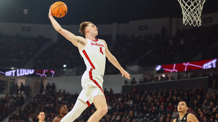 Jan 29, 2025; Starkville, Mississippi, USA; Alabama Crimson Tide forward Grant Nelson (4) dunks the ball against the Mississippi State Bulldogs during the first half at Humphrey Coliseum. Mandatory Credit: Wesley Hale-Imagn Images