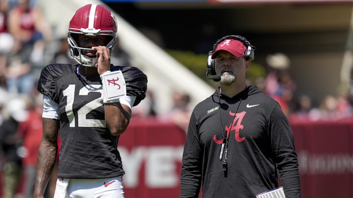 Apr 12, 2025; Tuscaloosa, AL, USA; Alabama quarterback Keelon Russell (12) stands with Alabama offensive coordinator Ryan Grubb during A-Day drills at Bryant-Denny Stadium. Mandatory Credit: Gary Cosby/USA TODAY NETWORK via Imagn Images