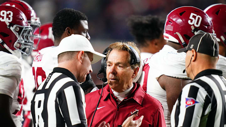 Nov 25, 2023; Auburn, Alabama, USA; Alabama Crimson Tide head coach Nick Saban listens to referee