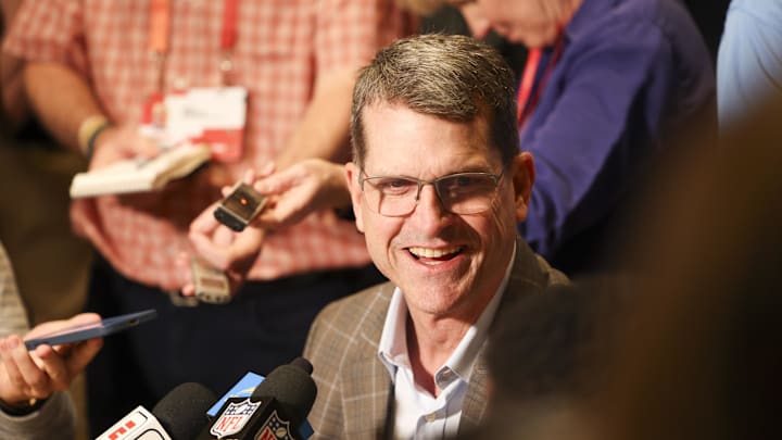 Mar 25, 2024; Orlando, FL, USA;  Los Angeles Chargers head coach Jim Harbaugh talks to media during