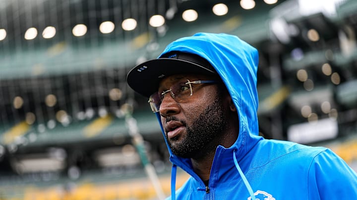 Detroit Lions defensive coordinator Kelvin Sheppard walks onto the field for warm up ahed of the Green Bay Packers game at Lambeau Field in Green Bay, Wis., on Sunday, September 7, 2025.