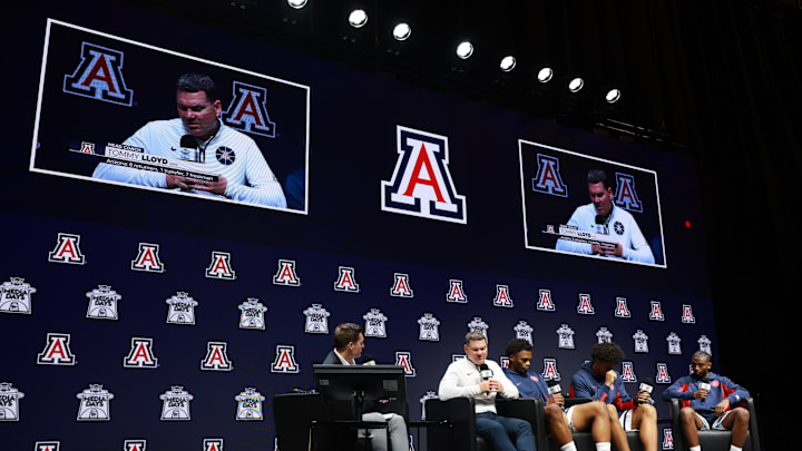 Oct 22, 2025; Kansas City, MO, USA; Arizona head coach Tommy Lloyd and players Tobe Awaka, Koa Peat and Jaden Bradley speaks to media during Big 12 Menís Basketball media day at T-Mobile Center. Mandatory Credit: Sophia Scheller-Imagn Images