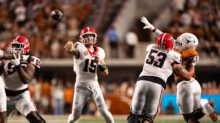 Oct 19, 2024; Austin, Texas, USA; Georgia Bulldogs quarterback Carson Beck (15) drops back to pass against the Texas Longhornsduring the first half at Darrell K Royal-Texas Memorial Stadium. Mandatory Credit: Brett Patzke-Imagn Images