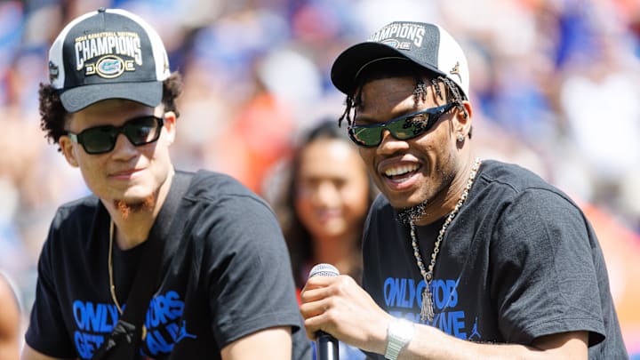 Apr 12, 2025; Gainesville, FL, USA; Florida Gators guard Alijah Martin (15) smiles while Florida Gators guard Walter Clayton Jr. (1) listens during the National Championship celebration at Ben Hill Griffin Stadium. Mandatory Credit: Matt Pendleton-Imagn Images