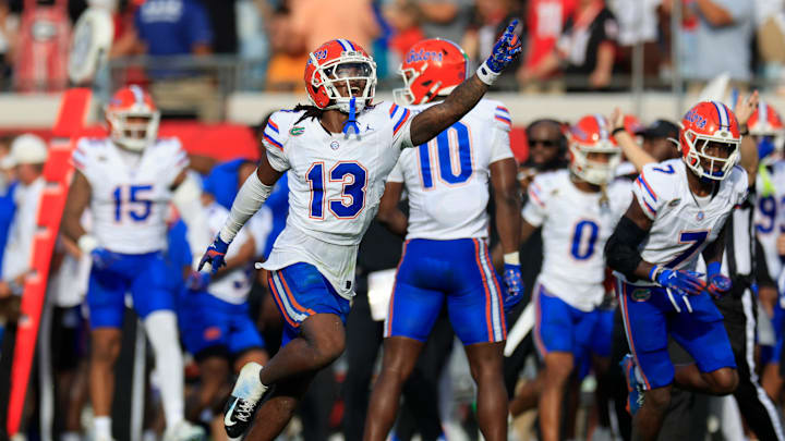 Florida Gators defensive back Aaron Gates (13) celebrates his interception during the second quarter of an NCAA college football matchup Saturday, Nov. 2, 2024 at EverBank Stadium in Jacksonville, Fla. The Georgia Bulldogs defeated the Florida Gators 34-20. [Corey Perrine/Florida Times-Union]