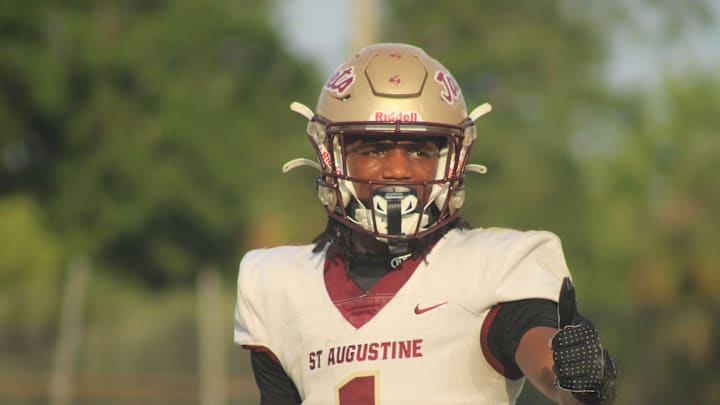 St. Augustine wide receiver Somourian Wingo (1) responds to a signal from the sideline with a thumbs-up against Bishop Kenny during a high school spring football game on May 21, 2025. [Clayton Freeman/Florida Times-Union]
