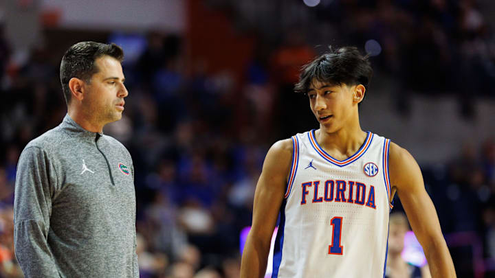 Nov 6, 2025; Gainesville, Florida, USA; Florida Gators head coach Todd Golden and Florida Gators guard Xaivian Lee (1) talk against the North Florida Ospreys during the second half at Exactech Arena at the Stephen C. O'Connell Center. Mandatory Credit: Matt Pendleton-Imagn Images