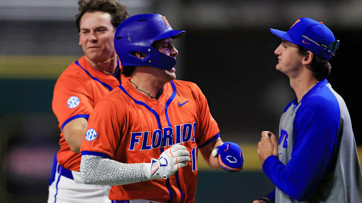 Florida infielder Brendan Lawson (11) reacts to scoring during the ninth inning of an NCAA college baseball matchup Tuesday, March 25, 2025 at VyStar Ballpark in Jacksonville, Fla. FSU rallied to defeat UF 8-4 off a walk-off grand slam from Alex Lodise in the ninth inning. [Corey Perrine/Florida Times-Union]