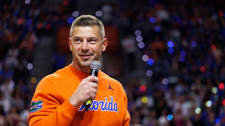 Jan 24, 2026; Gainesville, Florida, USA; Florida Gators Football head coach Jon Sumrall addresses the crowd during a timeout against the Auburn Tigers during the first half at Exactech Arena at the Stephen C. O'Connell Center. Mandatory Credit: Matt Pendleton-Imagn Images Jan 24, 2026; Gainesville, Florida, USA; Florida Gators Football head coach Jon Sumrall addresses the crowd during a timeout against the Auburn Tigers during the first half at Exactech Arena at the Stephen C. O'Connell Center. Mandatory Credit: Matt Pendleton-Imagn Images
